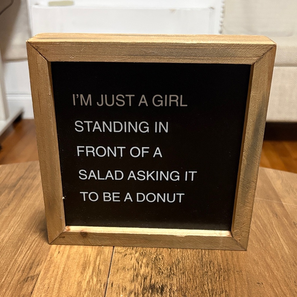 Black and Brown Wooden Quote Sign